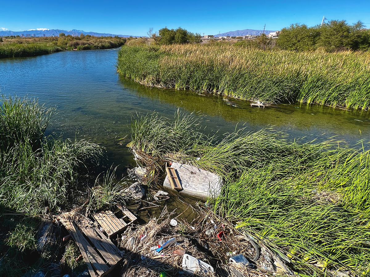 Trash accumulates along a bend in the Las Vegas Wash.